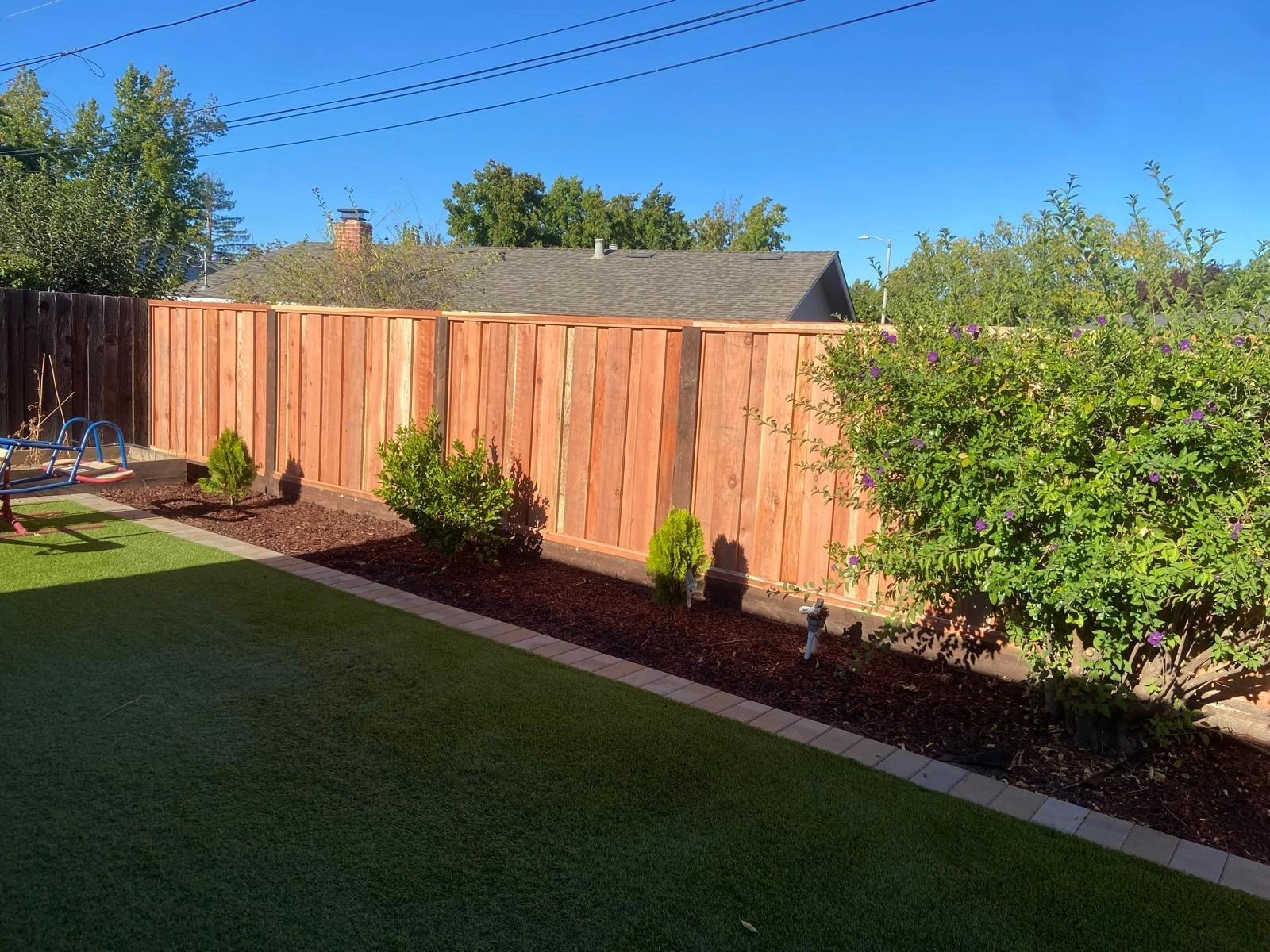 Board on board redwood privacy fence