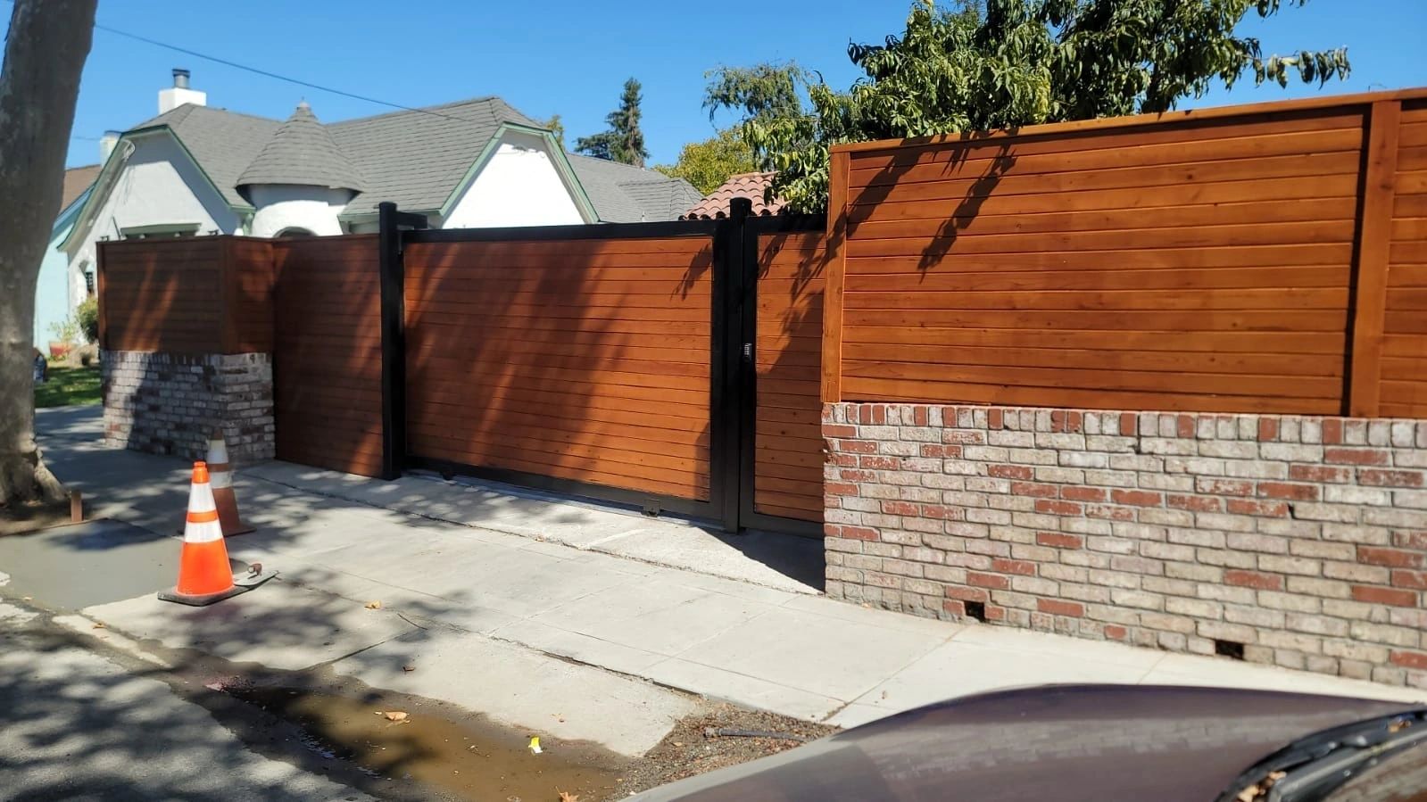 Automatic double gate installation with wood panel doors