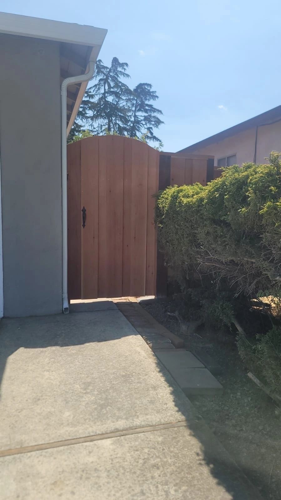 Front view of a 7-foot tall wood gate installation