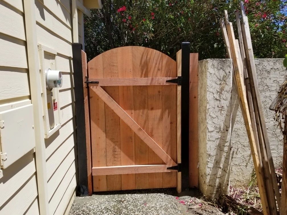 Back view of a Z-frame wood gate showing brace construction