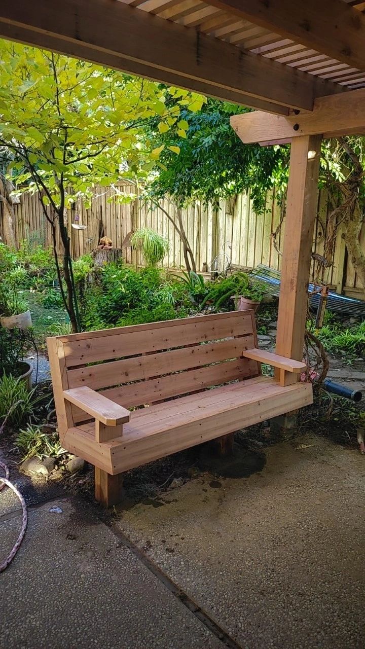 Custom redwood bench in a backyard setting