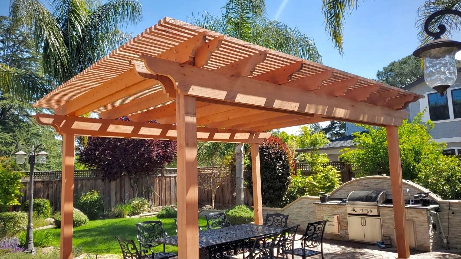 Redwood pergola shading a backyard patio