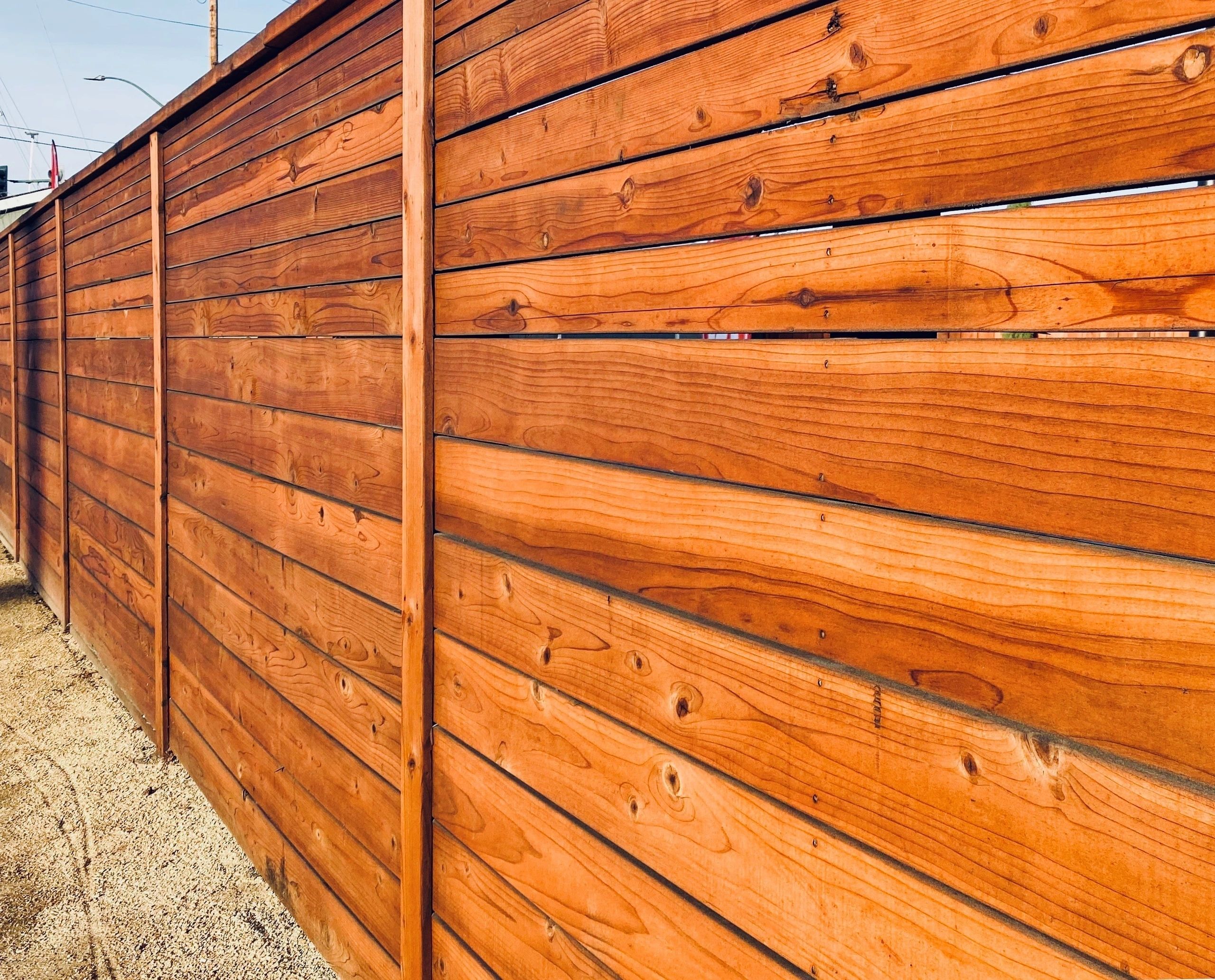 Modern horizontal redwood fence in a San Jose backyard