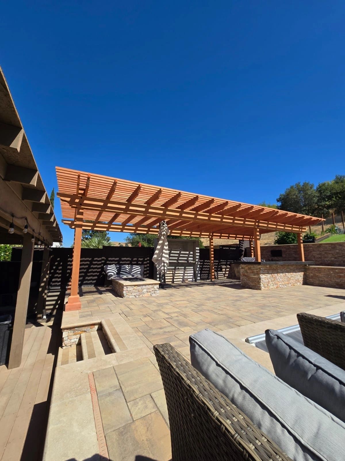 Custom redwood pergola over backyard patio