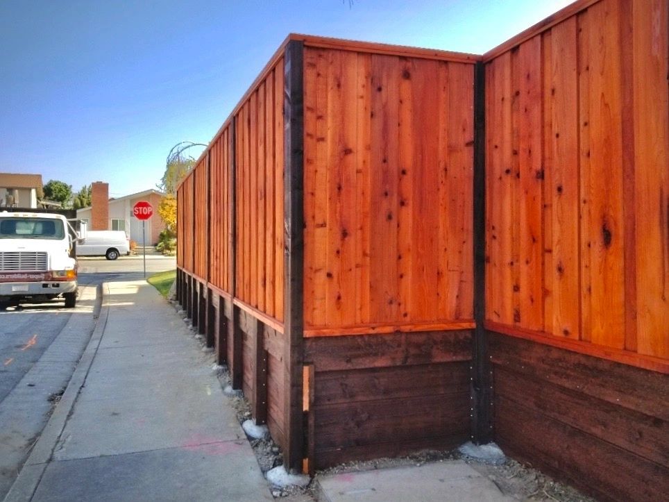 New retaining wall installed along residential sidewalk